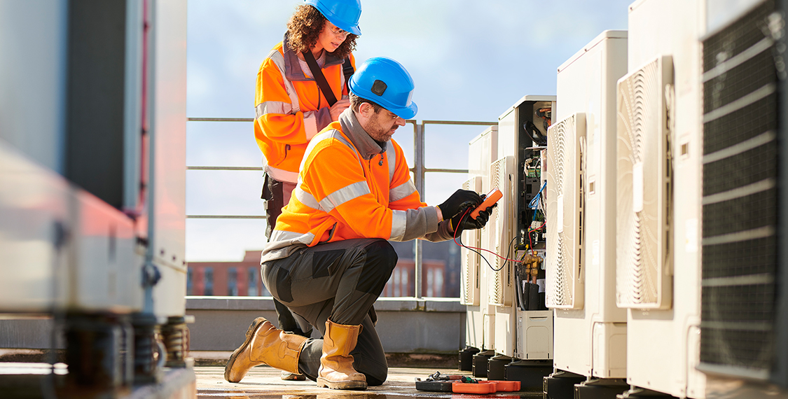 HVAC Technicians wearing reflective jackets