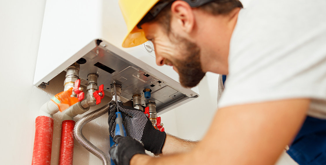 Technician repairing at heat pump